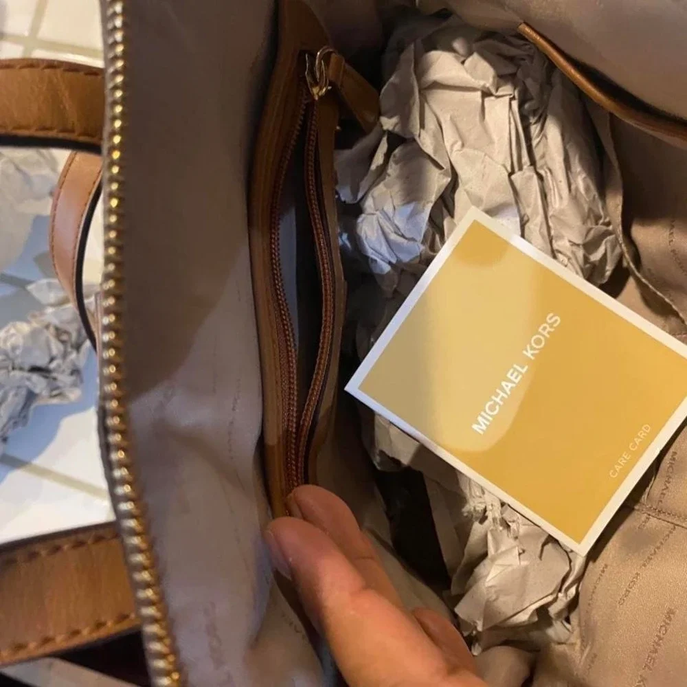 The Michael Kors Rhea Slim signature backpack